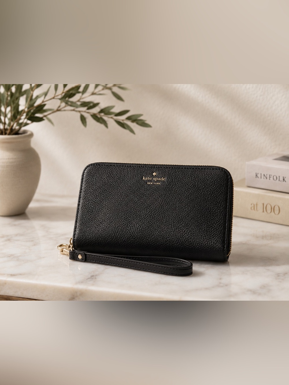 Kate Spade black pebbled genuine leather wristlet wallet with gold logo